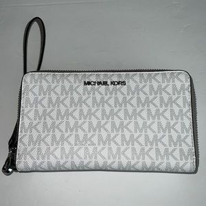 Michael Kors wristlet logo gray fits cell phone.